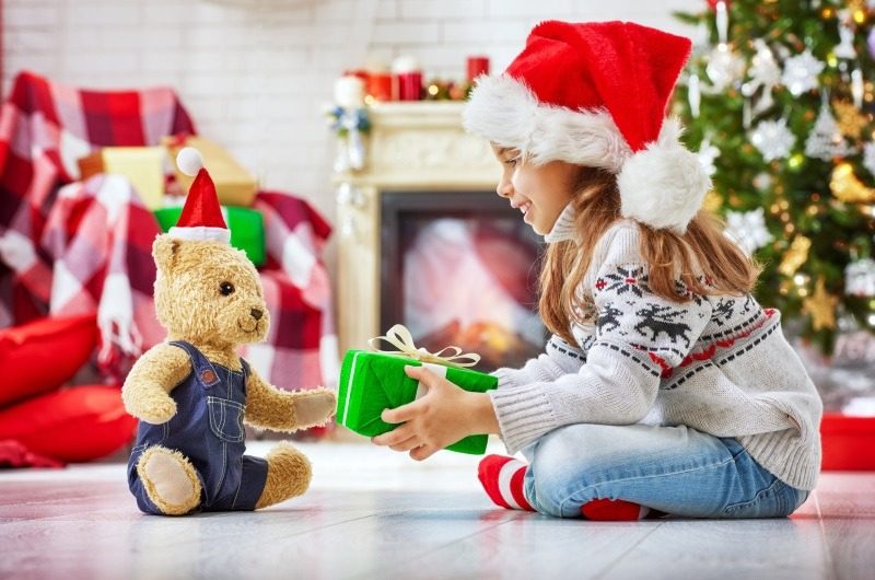 Christmas Child Santa Giving Gift to Teddy Bear